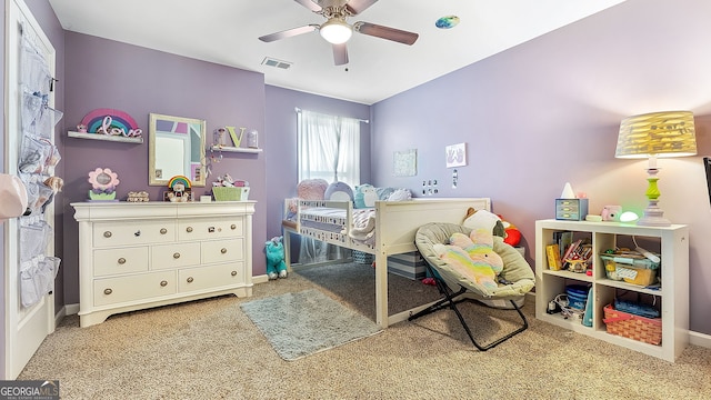 bedroom featuring visible vents, baseboards, ceiling fan, and carpet floors