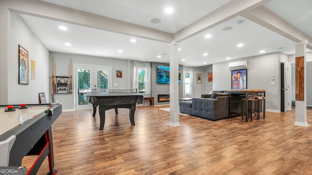 game room with light wood-type flooring, french doors, recessed lighting, and ornate columns