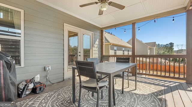 sunroom featuring a wealth of natural light and a ceiling fan