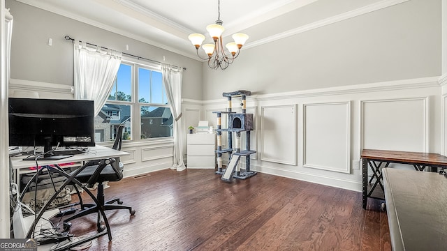 home office with ornamental molding, dark wood-style floors, a decorative wall, a raised ceiling, and a chandelier