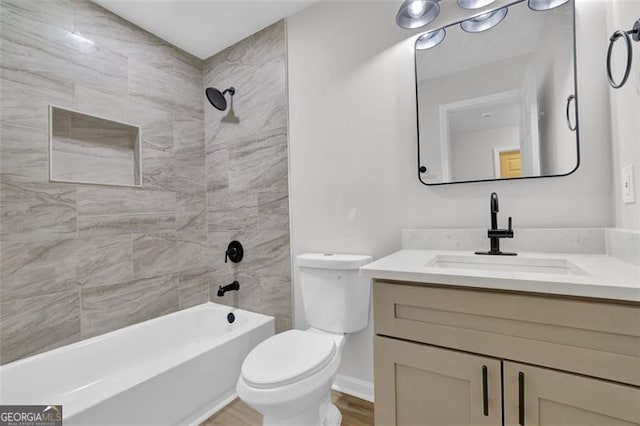 full bath featuring shower / tub combination, toilet, vanity, and wood finished floors