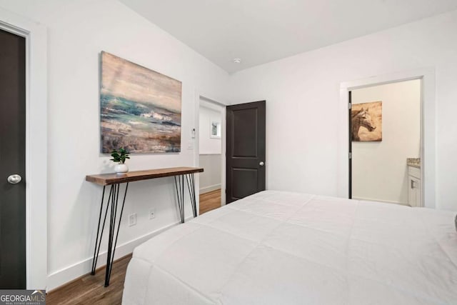 2664 Brown St NW, Atlanta, GA 30318 - bedroom featuring baseboards and wood finished floors