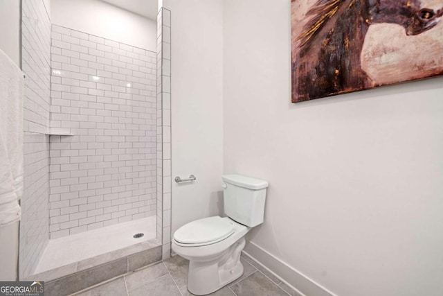 2664 Brown St NW, Atlanta, GA 30318 - full bath featuring tile patterned floors, toilet, baseboards, and a tile shower