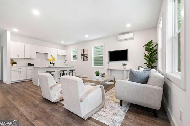 2664 Brown St NW, Atlanta, GA 30318 - living area with recessed lighting, baseboards, an AC wall unit, and dark wood finished floors