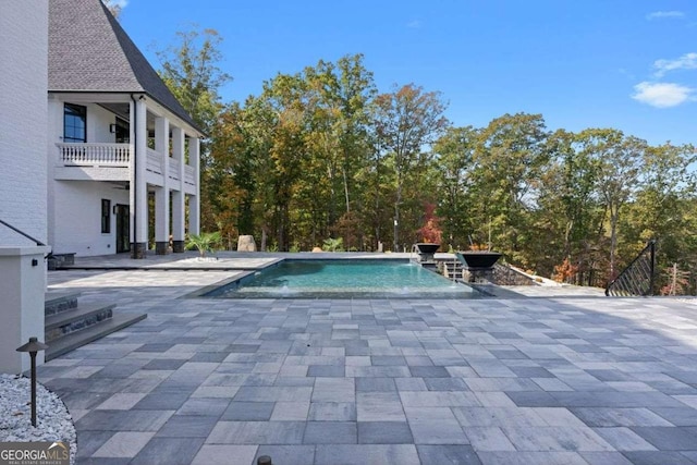 outdoor pool featuring a patio area