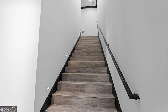 stairs with wood finished floors