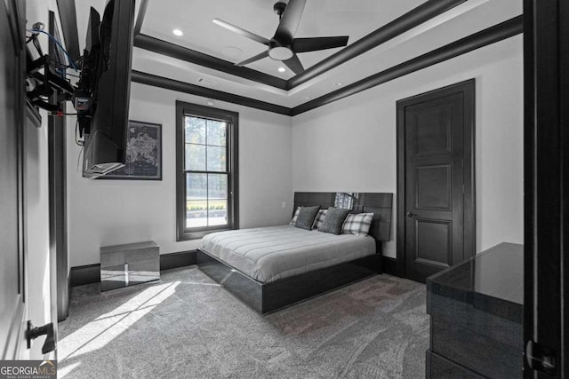 bedroom featuring dark colored carpet, baseboards, a raised ceiling, and recessed lighting