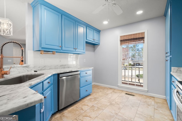 kitchen with stainless steel dishwasher, blue cabinetry, and a sink