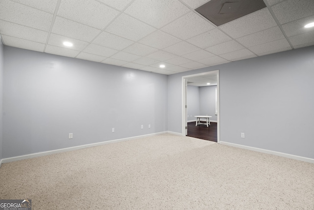 interior space featuring recessed lighting, a drop ceiling, baseboards, and carpet flooring