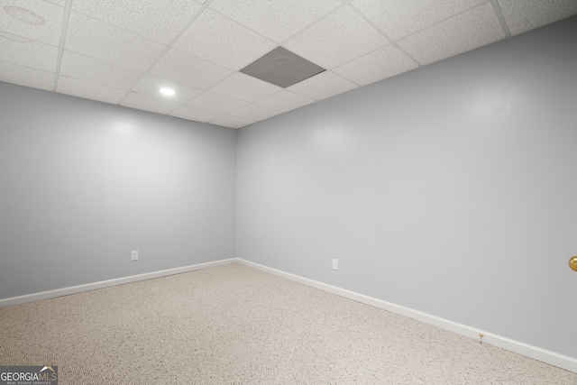 unfurnished room featuring recessed lighting, baseboards, and a drop ceiling