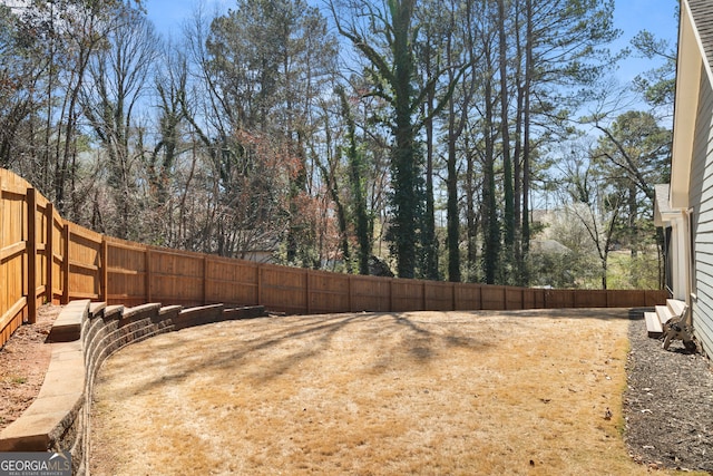 view of yard with a fenced backyard