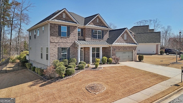 view of front facade featuring a standing seam roof, fence, concrete driveway, metal roof, and brick siding