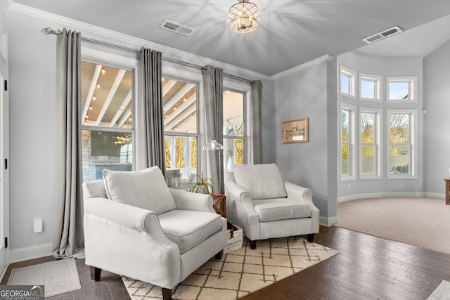 sitting room featuring visible vents, plenty of natural light, and hardwood / wood-style floors