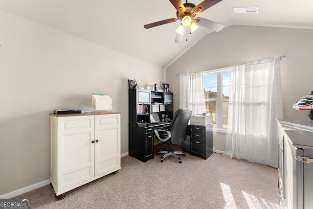 home office with visible vents, light carpet, lofted ceiling, a ceiling fan, and baseboards