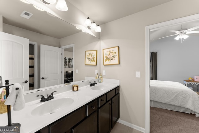 bathroom featuring a sink, visible vents, double vanity, and ensuite bathroom