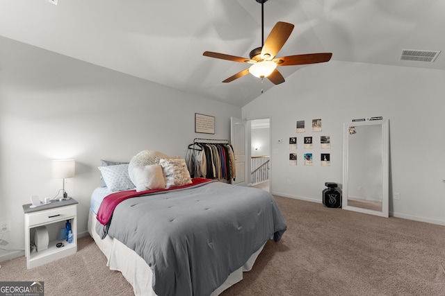 carpeted bedroom featuring visible vents, lofted ceiling, baseboards, and a ceiling fan