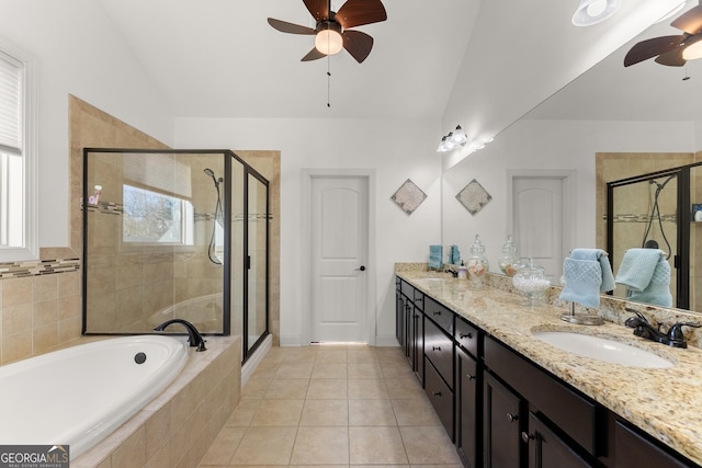 bathroom featuring a sink, a shower stall, a ceiling fan, and double vanity