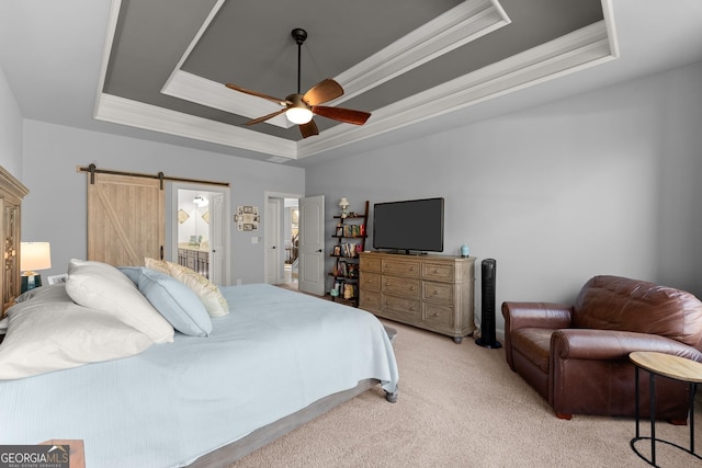 bedroom with ornamental molding, a barn door, a raised ceiling, light colored carpet, and ceiling fan