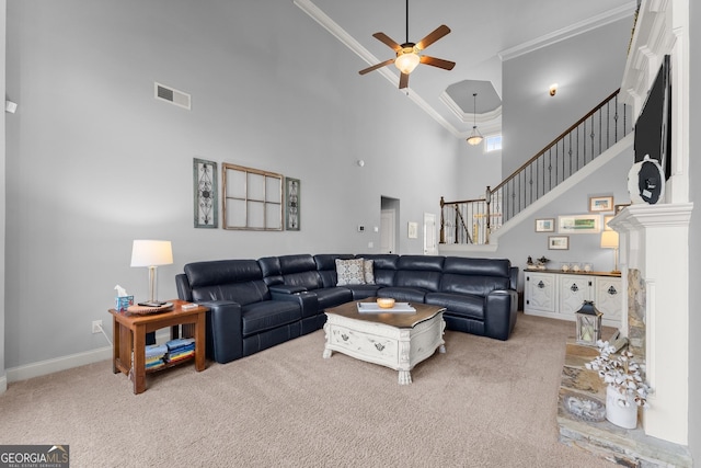 living room featuring visible vents, carpet, ornamental molding, a high ceiling, and a ceiling fan