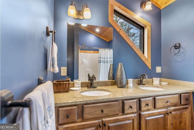 bathroom featuring double vanity and a sink