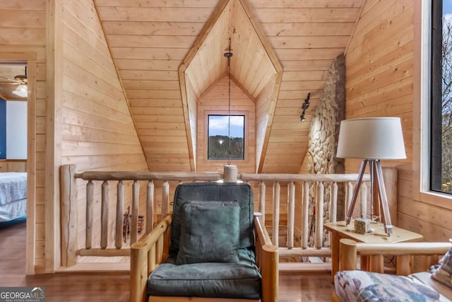 unfurnished room featuring wood walls, wood ceiling, lofted ceiling, and wood finished floors