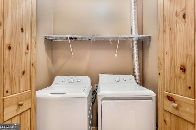 laundry area featuring laundry area and washing machine and dryer