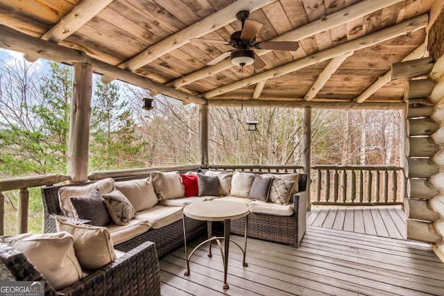 deck with an outdoor hangout area and a ceiling fan