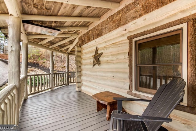 wooden terrace with a porch