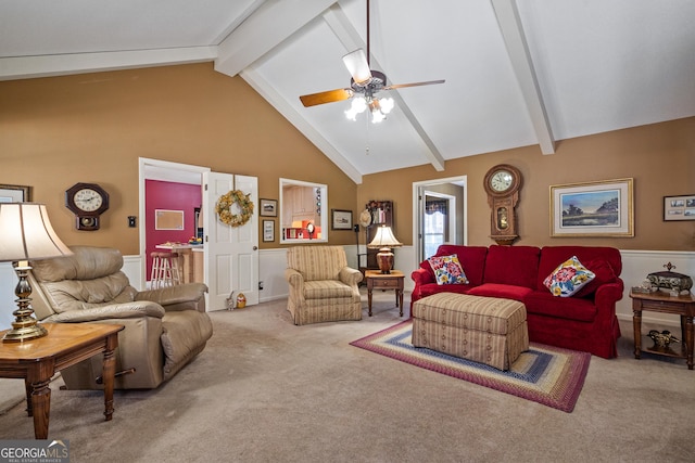 living room with beamed ceiling, high vaulted ceiling, ceiling fan, and carpet flooring