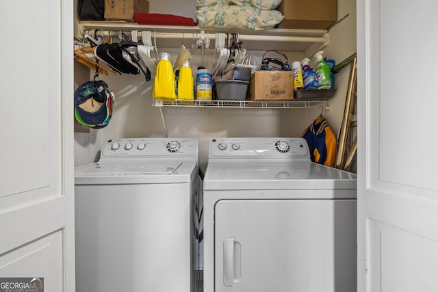 laundry room with independent washer and dryer and laundry area