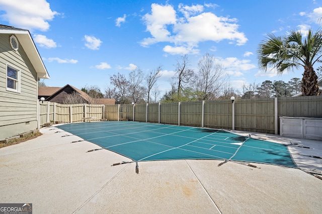 view of pool featuring a patio, a fenced backyard, and a fenced in pool