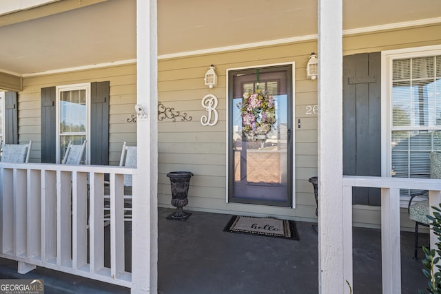 property entrance featuring covered porch