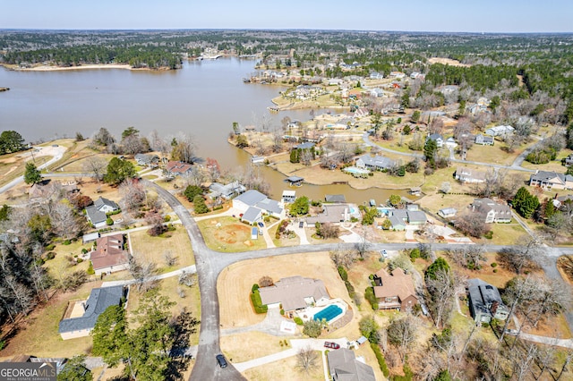 birds eye view of property with a residential view and a water view