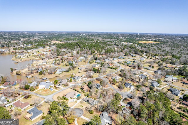 bird's eye view with a residential view and a water view