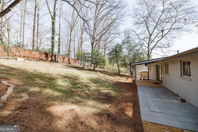 view of yard featuring a patio area and fence