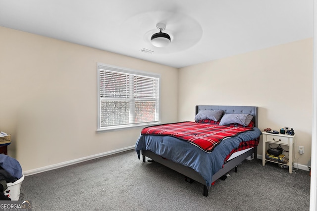 bedroom featuring a ceiling fan, carpet, visible vents, and baseboards