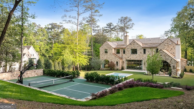 41 Blackland Rd NW, Atlanta, GA 30342 - surrounding community with a lawn, a tennis court, and fence