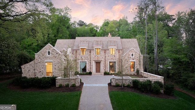 41 Blackland Rd NW, Atlanta, GA 30342 - french country style house with a lawn, a chimney, and stone siding
