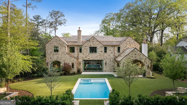 41 Blackland Rd NW, Atlanta, GA 30342 - back of house with a yard, an outdoor pool, a patio area, and a chimney