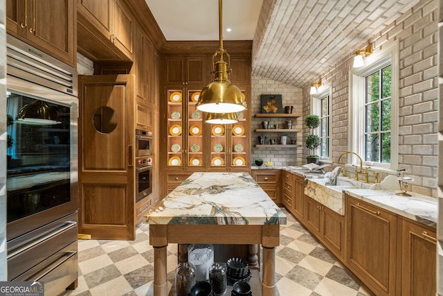 41 Blackland Rd NW, Atlanta, GA 30342 - kitchen with light floors, brick wall, open shelves, and a sink