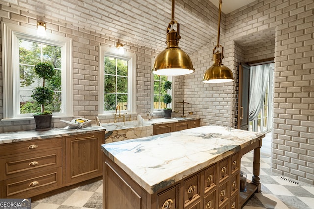 41 Blackland Rd NW, Atlanta, GA 30342 - kitchen with brick wall, lofted ceiling, and a healthy amount of sunlight