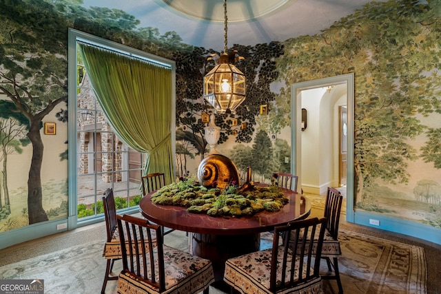 41 Blackland Rd NW, Atlanta, GA 30342 - dining area with wallpapered walls, arched walkways, and a chandelier