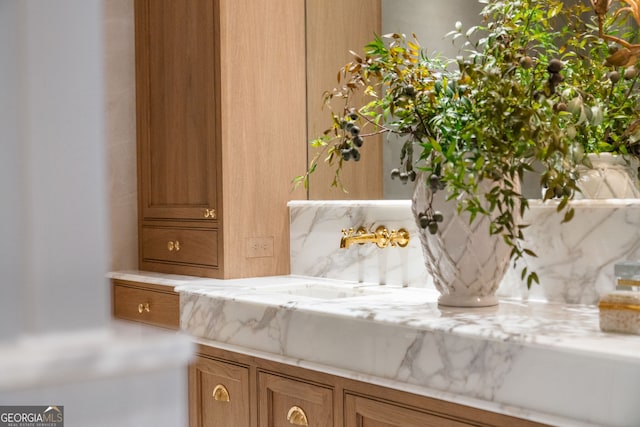 41 Blackland Rd NW, Atlanta, GA 30342 - details with decorative backsplash and a sink
