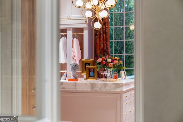 41 Blackland Rd NW, Atlanta, GA 30342 - bathroom featuring an inviting chandelier and vanity