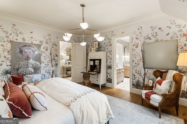 41 Blackland Rd NW, Atlanta, GA 30342 - bedroom featuring wallpapered walls, wood finished floors, ornamental molding, and ensuite bathroom