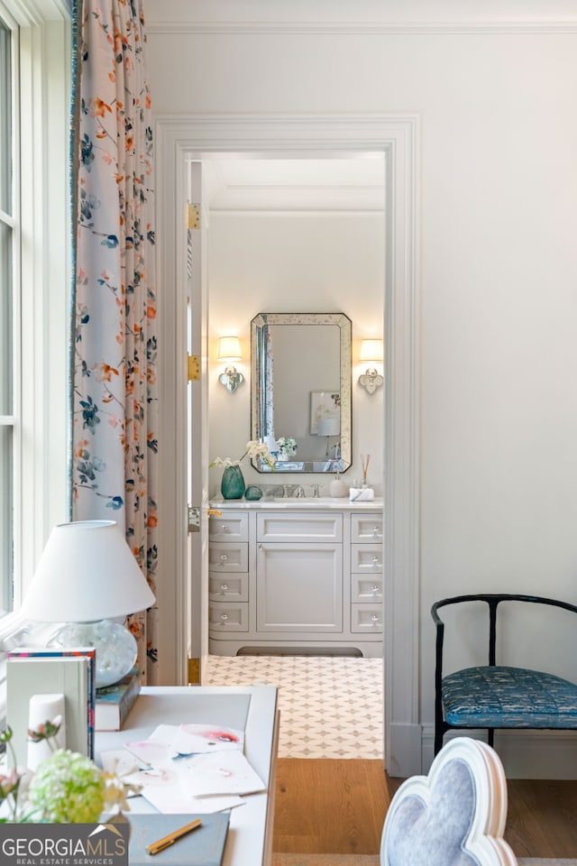 41 Blackland Rd NW, Atlanta, GA 30342 - bedroom with wood finished floors, ornamental molding, and a sink
