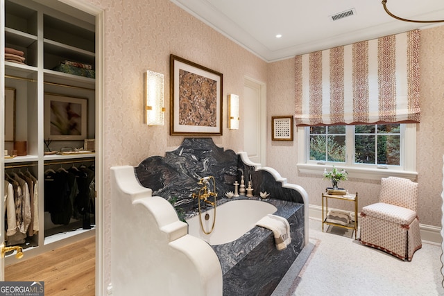41 Blackland Rd NW, Atlanta, GA 30342 - living area featuring wallpapered walls, wood finished floors, visible vents, and crown molding