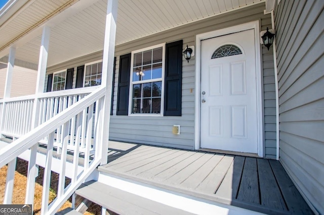 doorway to property featuring covered porch