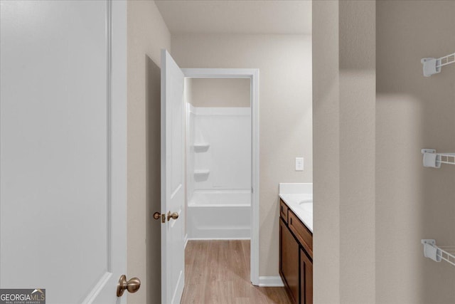 bathroom with vanity and wood finished floors