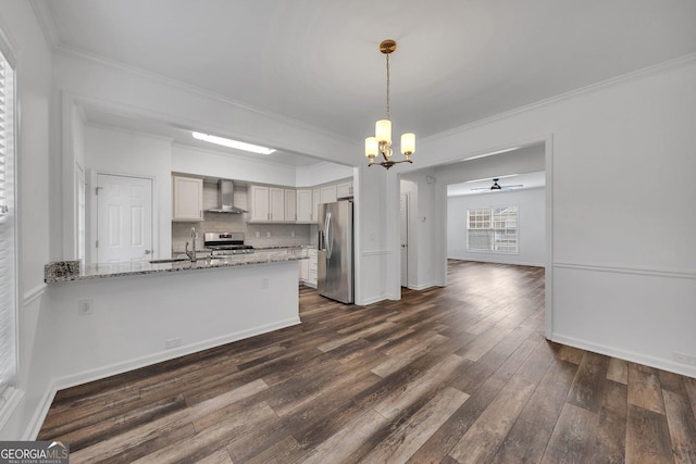 kitchen featuring tasteful backsplash, a peninsula, dark wood-style floors, stainless steel appliances, and wall chimney exhaust hood